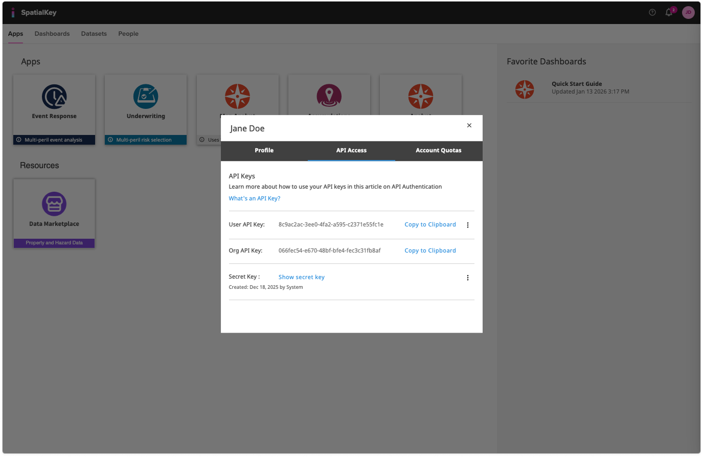Dashboard view of the SpatialKey web application with a modal window open showing a user profile titled **“Jane Doe.”** The **API Access** tab is selected, displaying API keys, a secret key option, and buttons to copy credentials to the clipboard, indicating where users manage and configure their geospatial API access.
