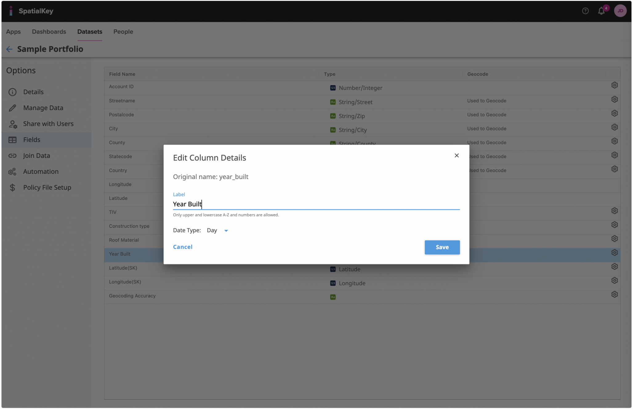 Image of the SpatialKey dataset Fields page with an ‘Edit Column Details’ modal open for a date field labeled ‘Year Built.’ The modal shows options to change the field label and select a date type, illustrating how clicking the gear (settings) icon for a field allows users to modify its format and configuration. The fields table with data types and geocoding indicators remains visible in the background.