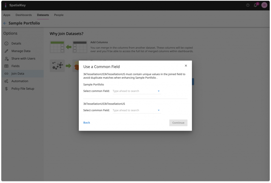 Image of the SpatialKey Join Data workflow with a modal titled ‘Use a Common Field.’ The dialog prompts the user to select matching fields from two datasets to join them, with dropdowns for choosing the common field in each dataset. A Back link and a disabled Continue button appear at the bottom, while the Join Data page remains visible but dimmed in the background.
