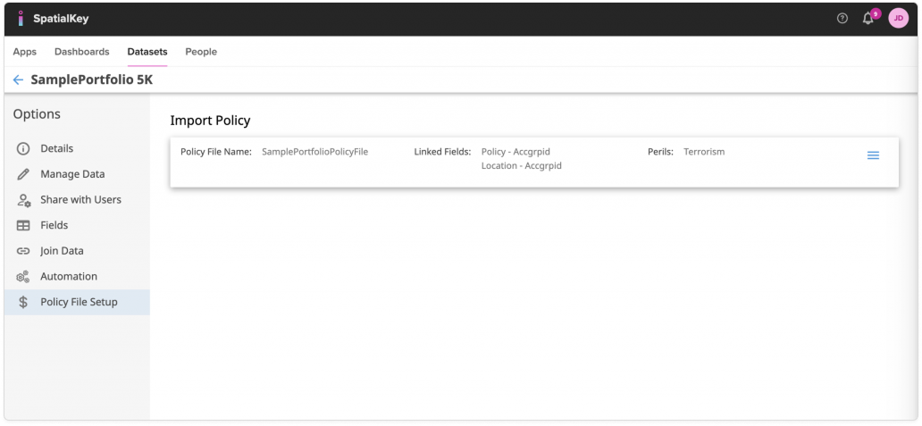 Image of the SpatialKey Policy File Setup page showing a completed Import Policy summary bar. The summary displays the policy file name, the linked fields used to join policy and location data, and the associated peril (Terrorism), confirming that the policy file has been successfully configured and attached to the dataset. The left navigation highlights Policy File Setup, indicating this is the final state after completing the policy import workflow.