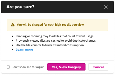 “A confirmation dialog titled ‘Are you sure?’ displays a warning that viewing high‑resolution tiles will incur charges. Bullet points explain that panning or zooming may load additional chargeable tiles, previously viewed tiles are cached to avoid duplicate charges, and a tile counter can be used to track estimated consumption. Options include a ‘Don’t show again’ checkbox, a purple ‘Yes, View Imagery’ button, and a ‘Cancel’ button.”